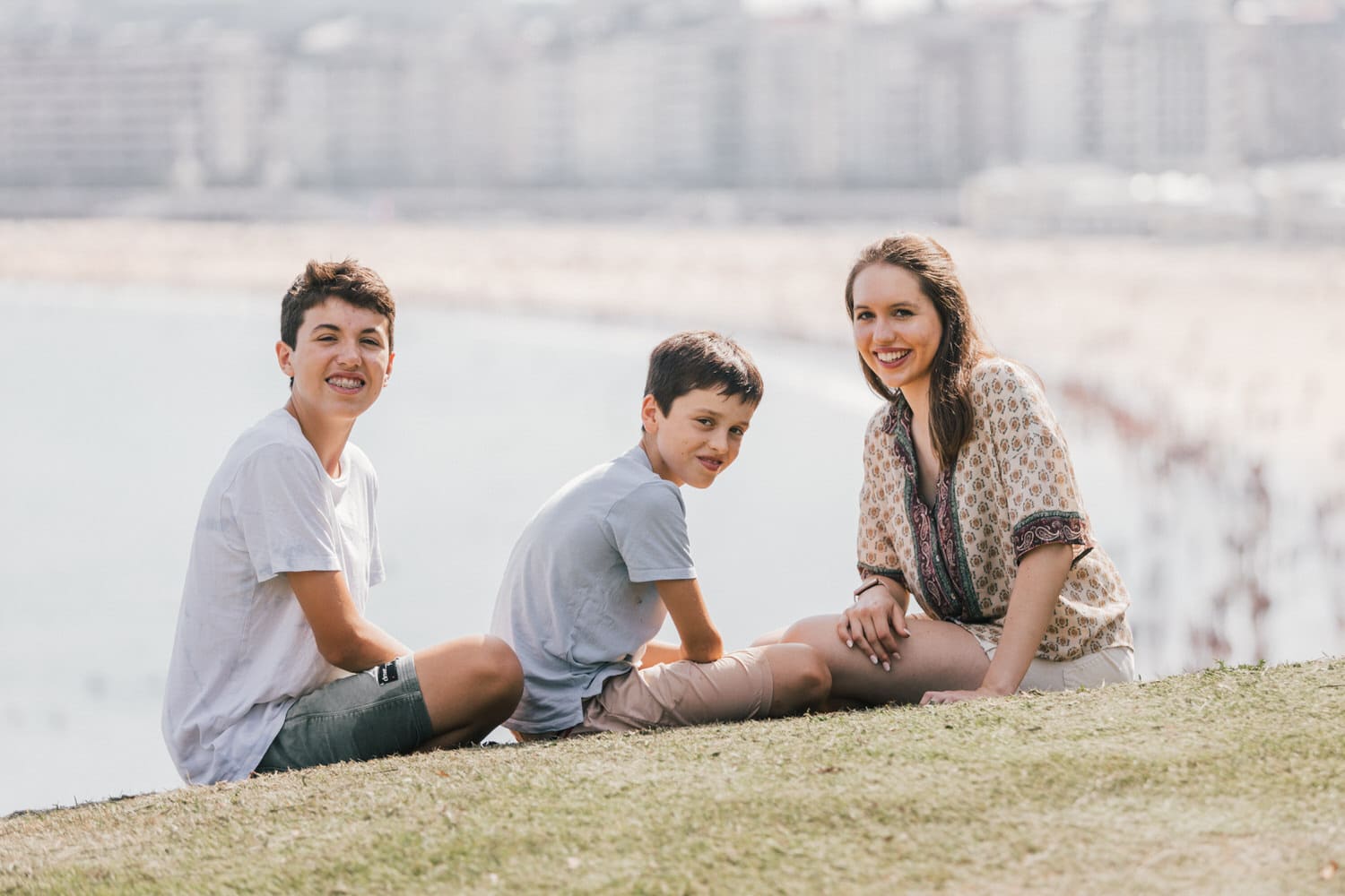 Family enjoying vacation photoshoot in La Concha Beach, Donostia